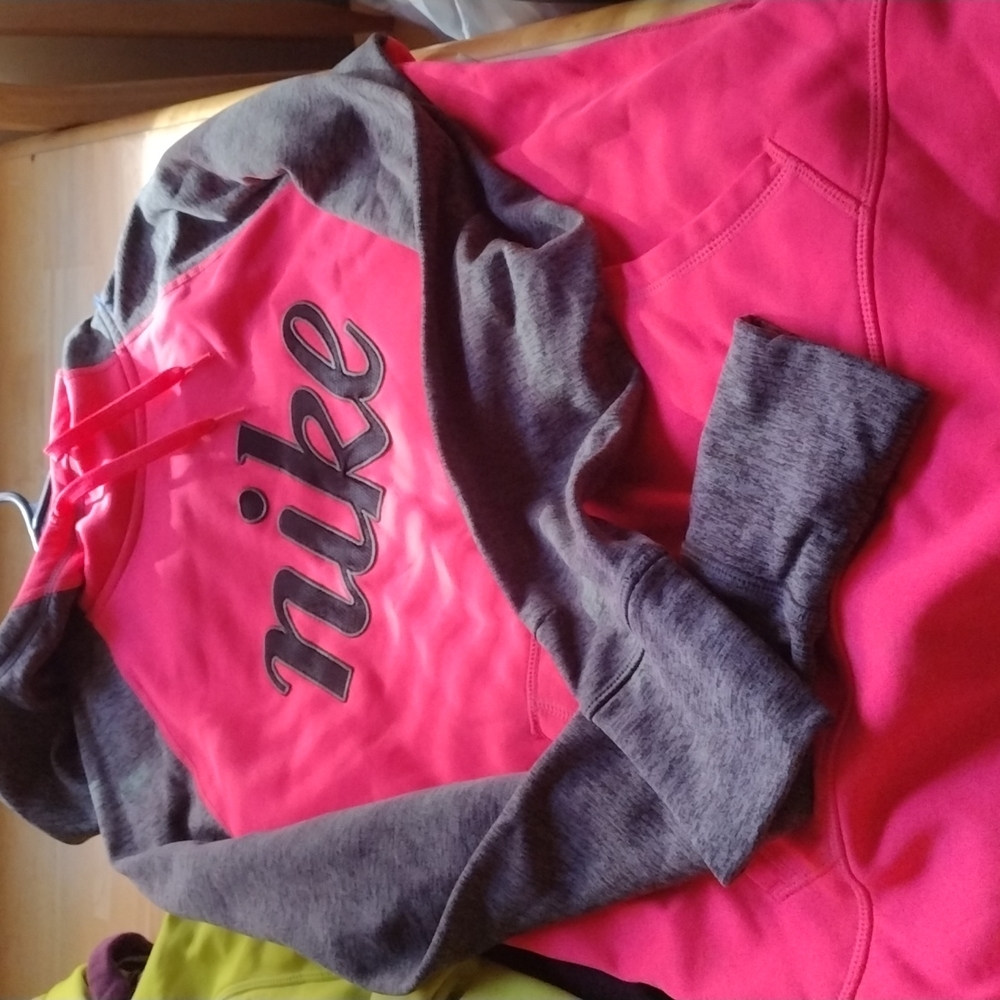 Nike hoodies both in like new condition..the pink hoodie was never worn.